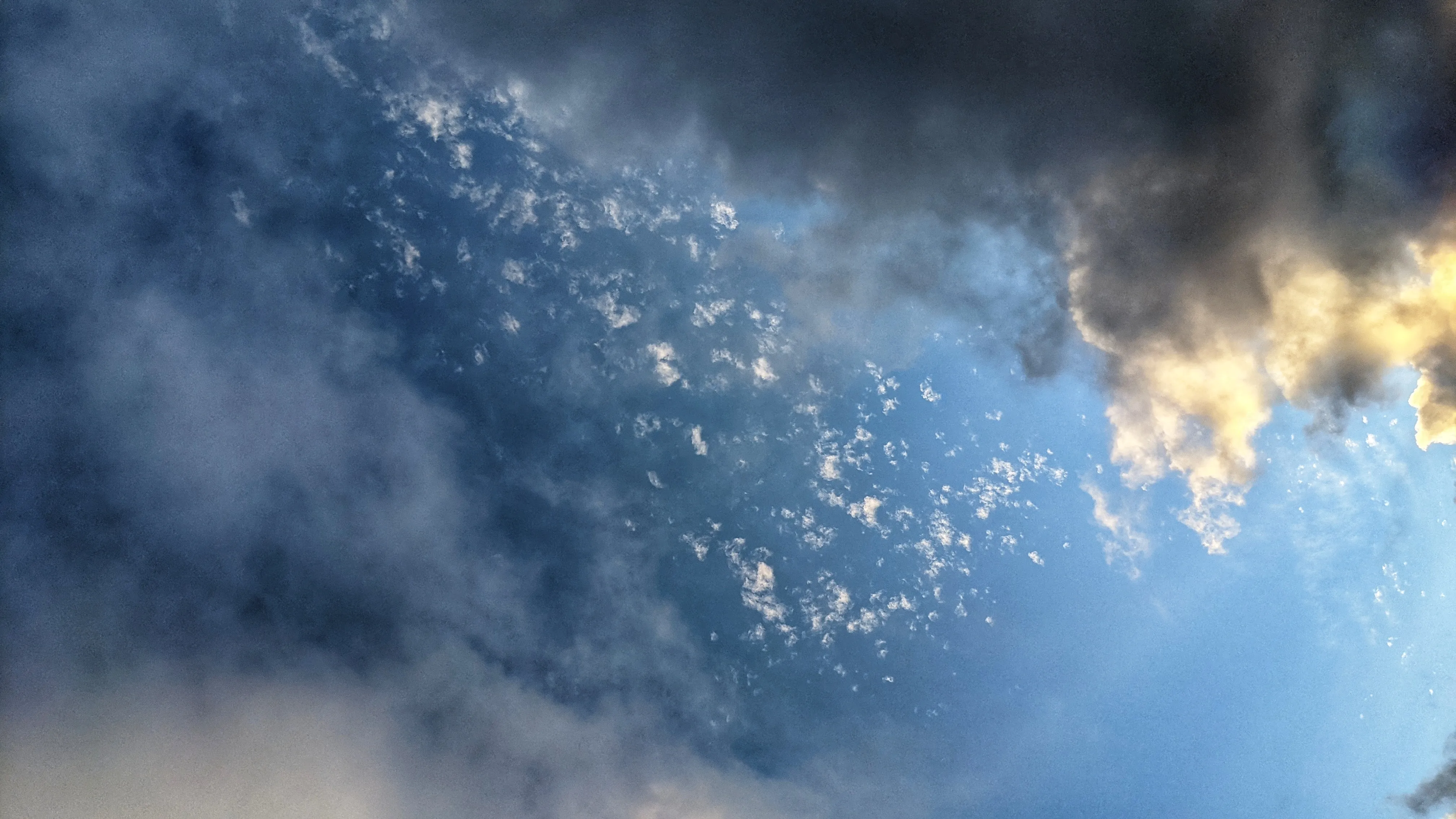 Dark clouds with a clear sky behind them